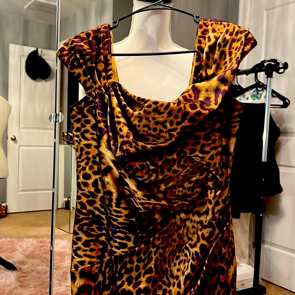 Beautiful mid length leopard dress. Ruched sleeveless size 12.